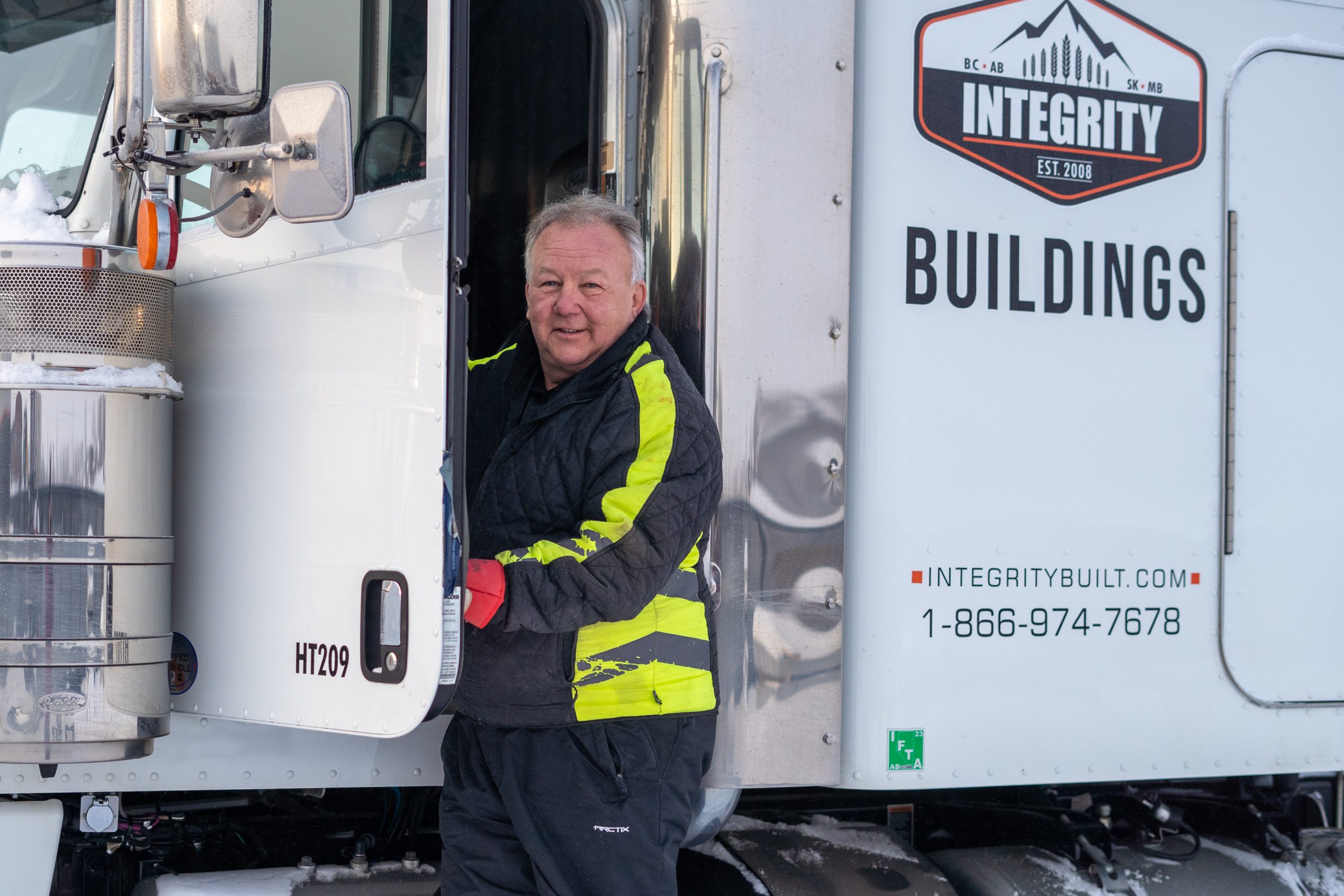 Robin Miller standing by Integrity truck
