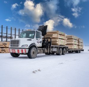 Integrity Building Product truck loaded with prefabricated wall panels