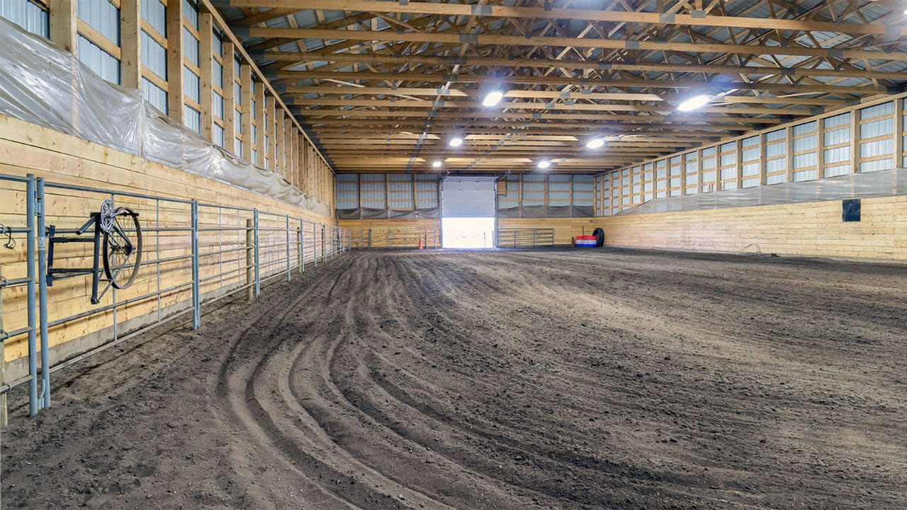 Post-frame Riding Arena by Integrity Post Structures inside