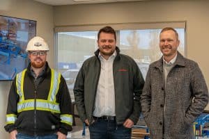 Elliott LaBlanc, Timo Weber, and Scott Myer at Hundegger Open House at IBC