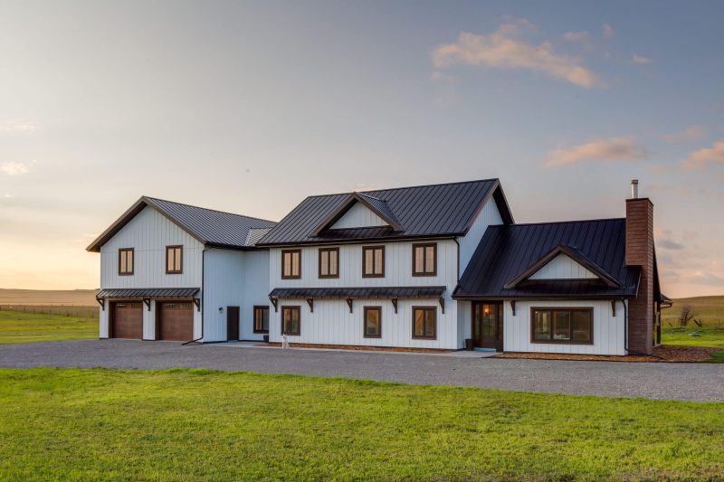 Side angle of the Modern Farmhouse, emphasizing its modern aesthetic and energy-efficient features.