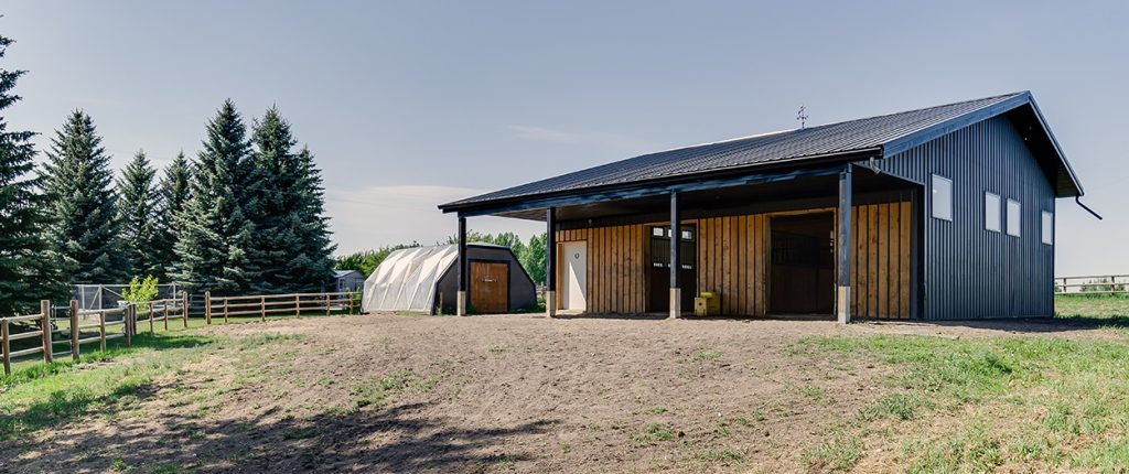 A Charcoal Steel post-frame horse Barn