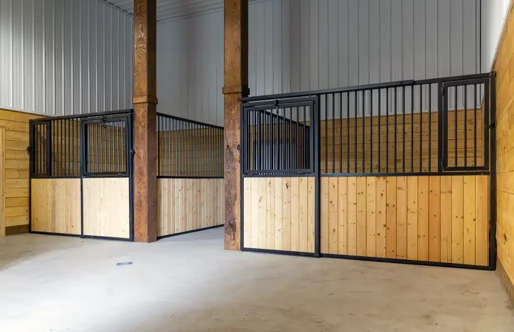 A buckskin post-frame equestrian barn