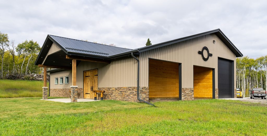 A buckskin post-frame equestrian barn