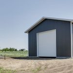 A charcoal lifestyle & Hobby post-frame shop with one chain overhead door