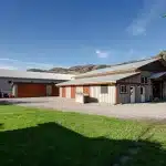 A Stone Grey post-frame equestrian Riding Arena