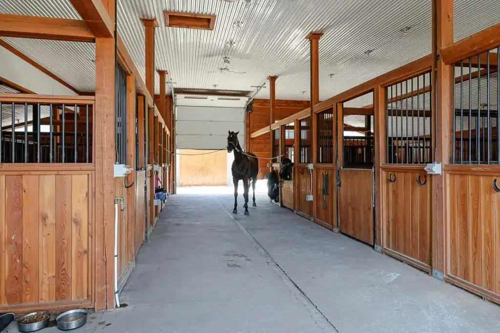 A Stone Grey post-frame equestrian Riding Arena