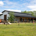 A bright white post-frame community centre