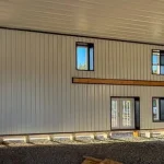 A black post-frame hangar