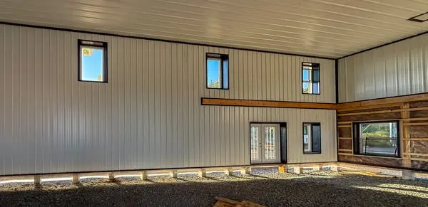 A black post-frame hangar