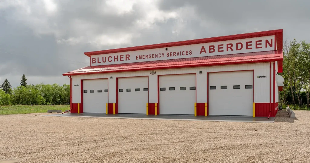 Bright white post-frame commercial Fire Hall