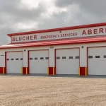 Bright white post-frame commercial Fire Hall