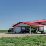 A bright white post-frame lifestyle & hobby shop