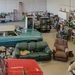 A white post-frame lifestyle & hobby shop