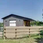 A Charcoal Steel post-frame horse Barn