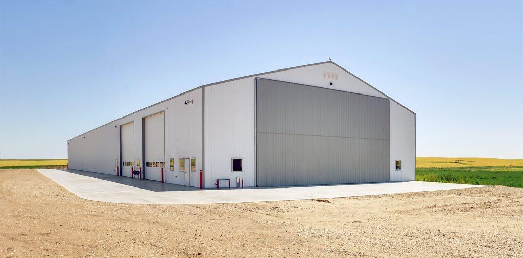 A bright white post-frame agricultural shop