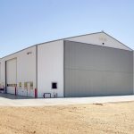 A bright white post-frame agricultural shop