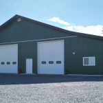 A melchers green lifestyle & Hobby post-frame shop with two overhead doors and soffits