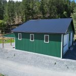 A melchers green lifestyle & Hobby post-frame shop with two overhead doors and soffits
