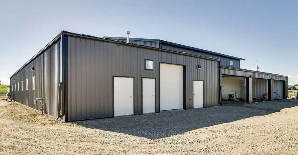 A charcoal post-frame commercial building