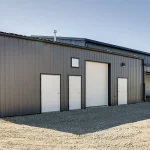 A charcoal post-frame commercial building