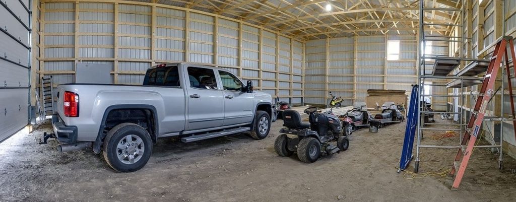 A charcoal lifestyle & Hobby post-frame shop with one chain overhead door