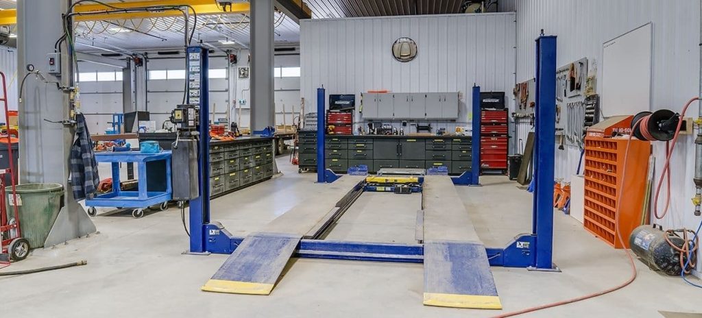 An iron ore post-frame commercial build with ten overhead doors