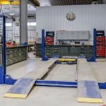 An iron ore post-frame commercial build with ten overhead doors