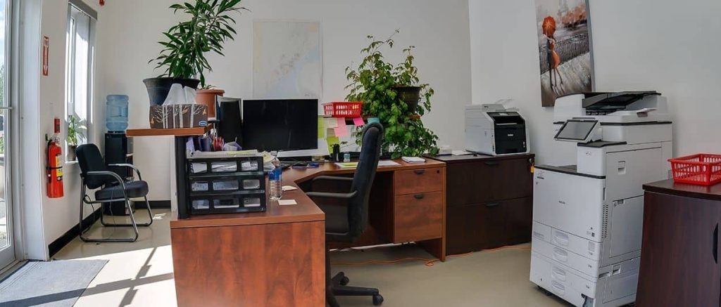 An iron ore post-frame commercial build with ten overhead doors
