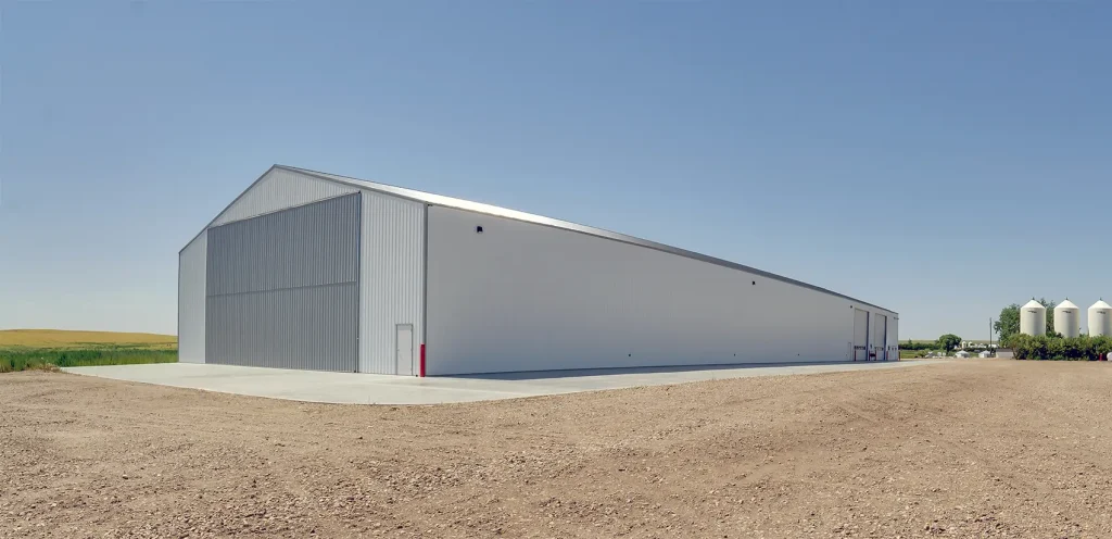 A bright white post-frame agricultural shop
