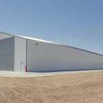 A bright white post-frame agricultural shop