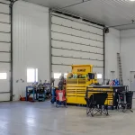 A bright white post-frame agricultural shop