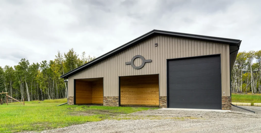 A buckskin post-frame equestrian barn