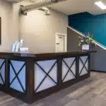 A charcoal post-frame commercial building