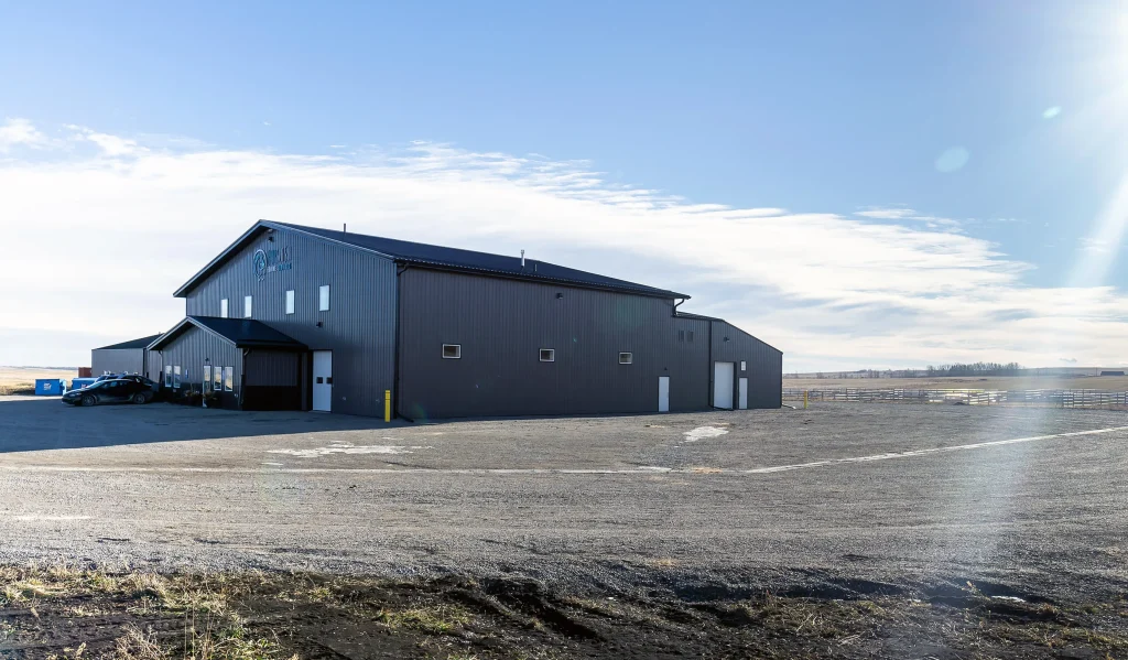 A charcoal post-frame commercial building