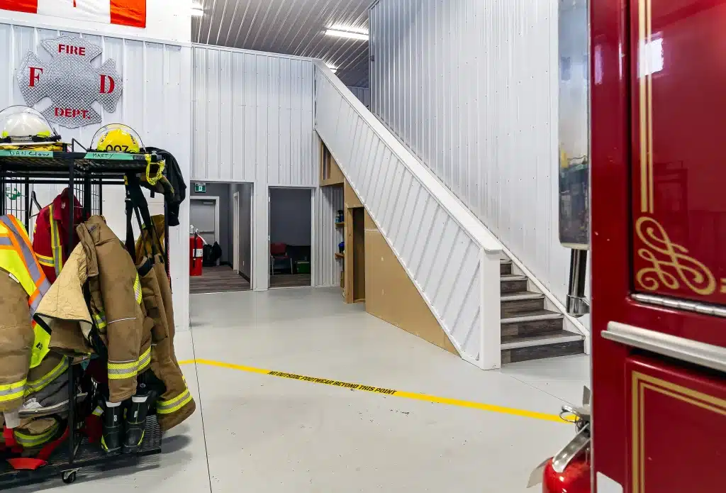 Interior of a dark red post-frame commercial fire hall