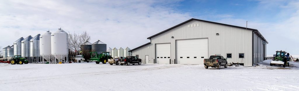 an Iron ore agricultural post-frame shop with three overhead doors and bi-fold door