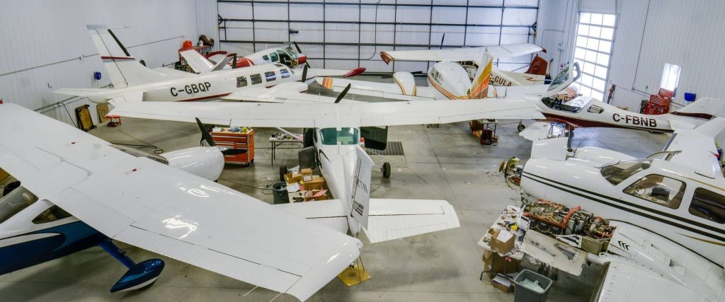 An iron ore post-frame commercial build with a bi-fold door