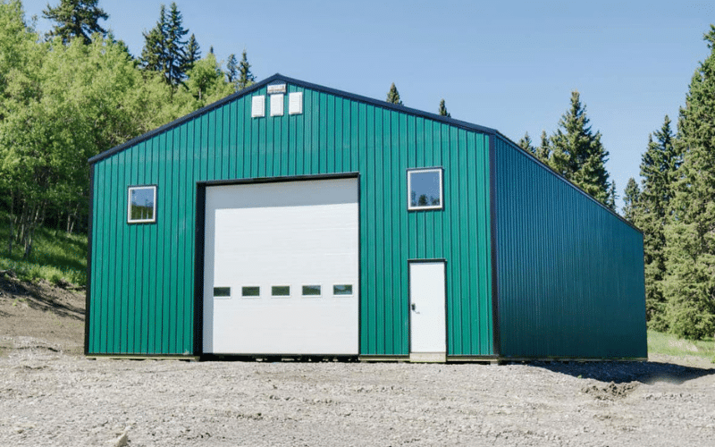 A melchers green Agricultural post-frame shop with one overhead door