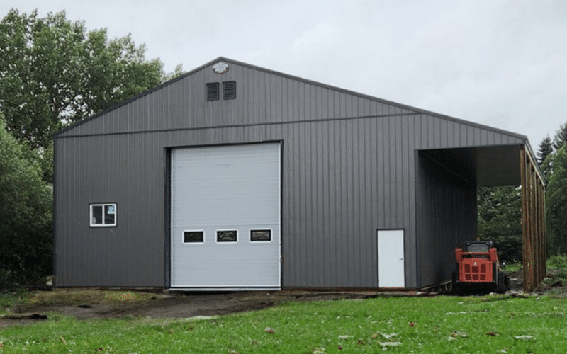 A iron ore lifestyle & hobby post-frame shop with one overhead door and open lean-to