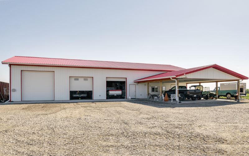 A bright white lifestyle & hobby shop with three overhead doors