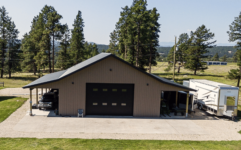 A buckskin lifestyle & hobby post-frame acreage with two overhead doors