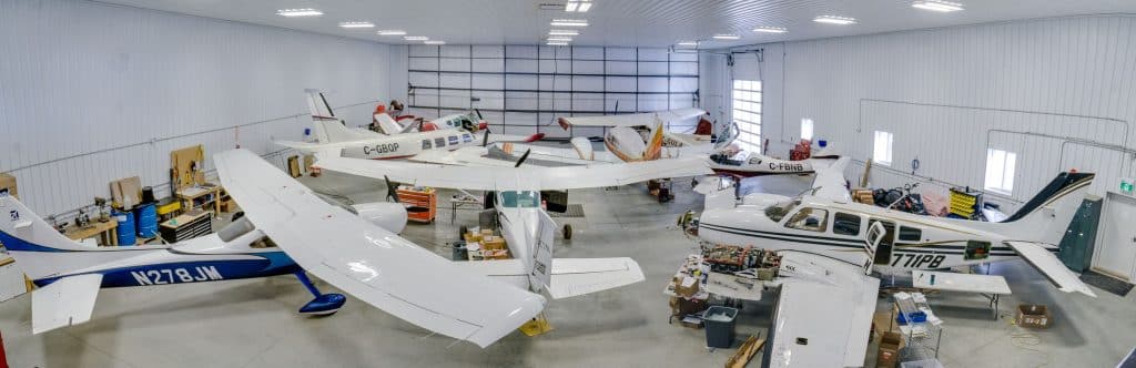 An iron ore post-frame commercial build with a bi-fold door