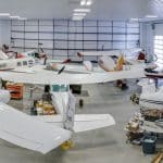 An iron ore post-frame commercial build with a bi-fold door