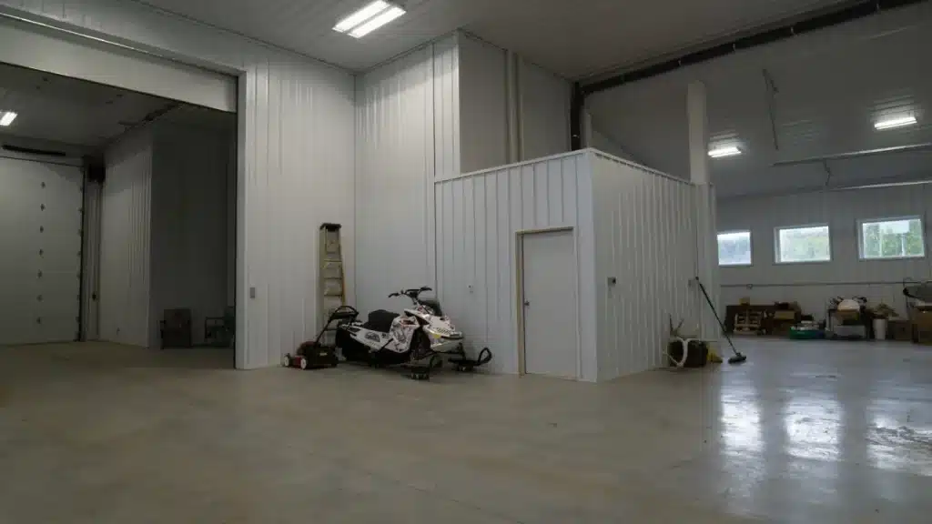 A buckskin post-frame equestrian barn