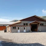 A Stone Grey post-frame equestrian Riding Arena