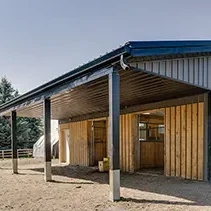 A Charcoal Steel post-frame horse Barn
