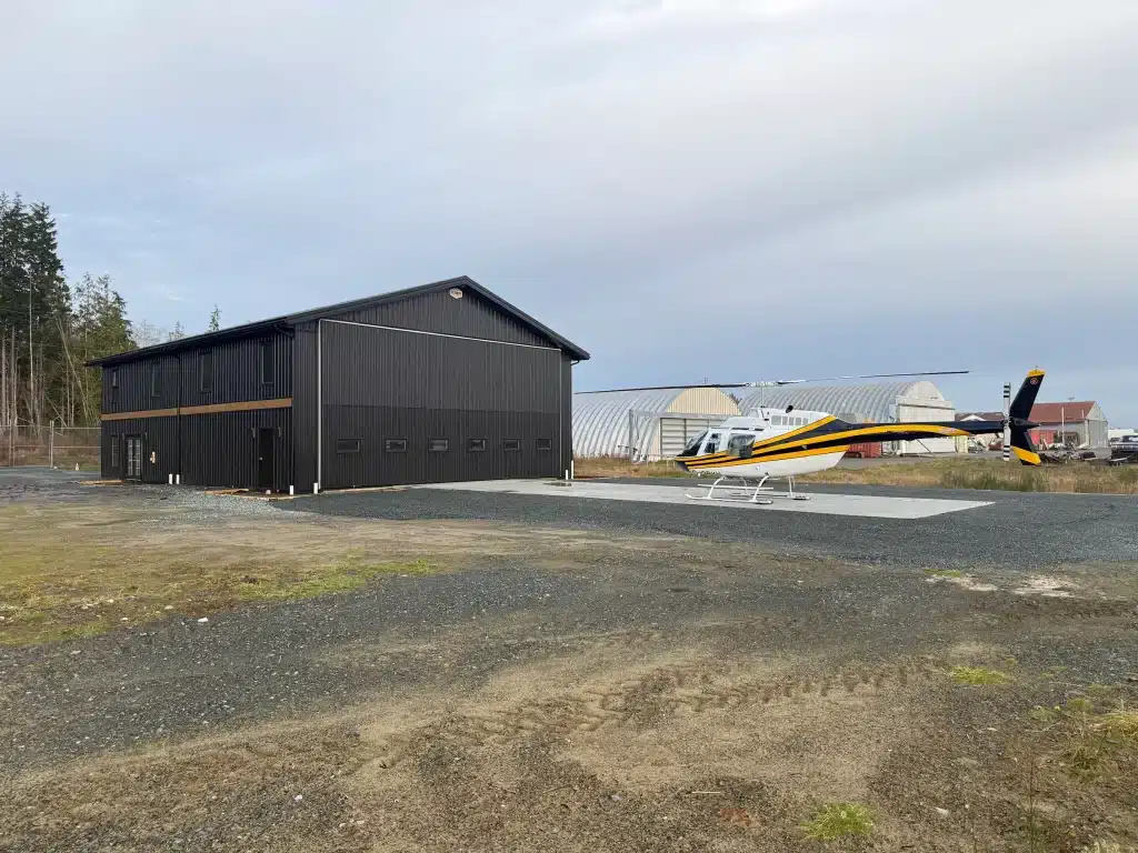 A black post-frame hangar