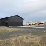 A black post-frame hangar