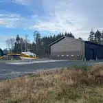 A black post-frame hangar